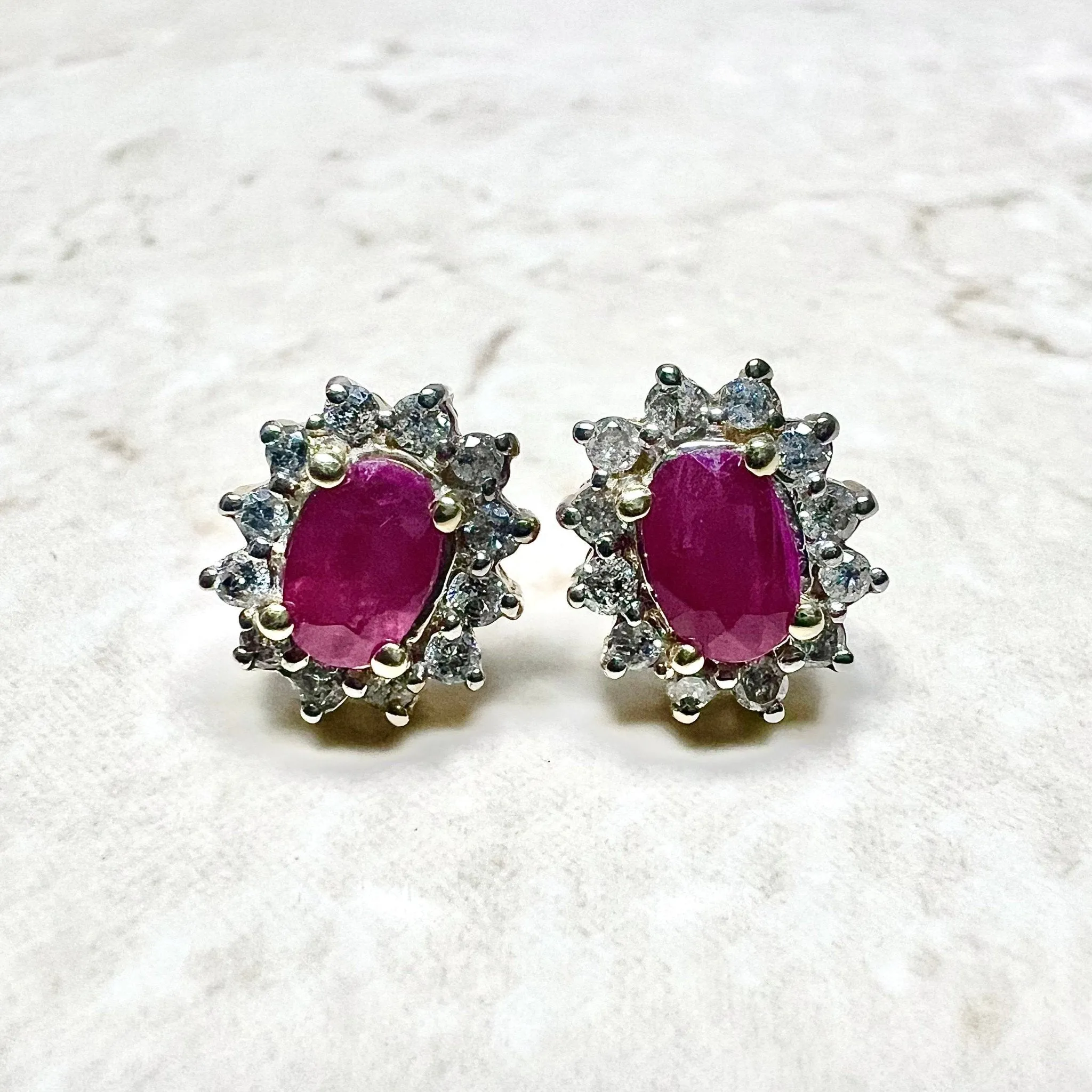 10 Karat Two-Tone Gold Diamond & Oval Ruby Halo Stud Earrings
