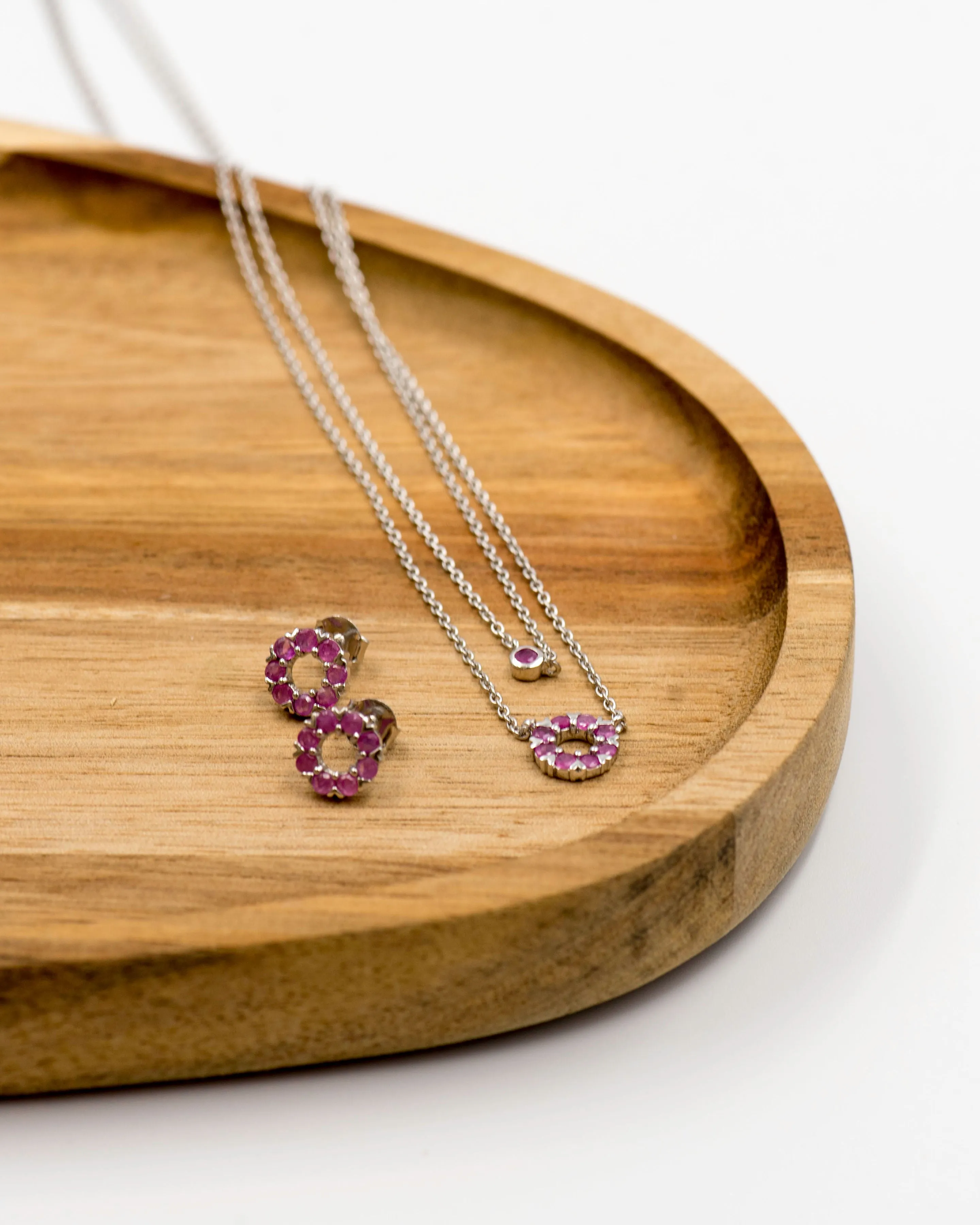 131 "Elegant silver round earrings and chain set, featuring a combination round pendant with July ruby stones.