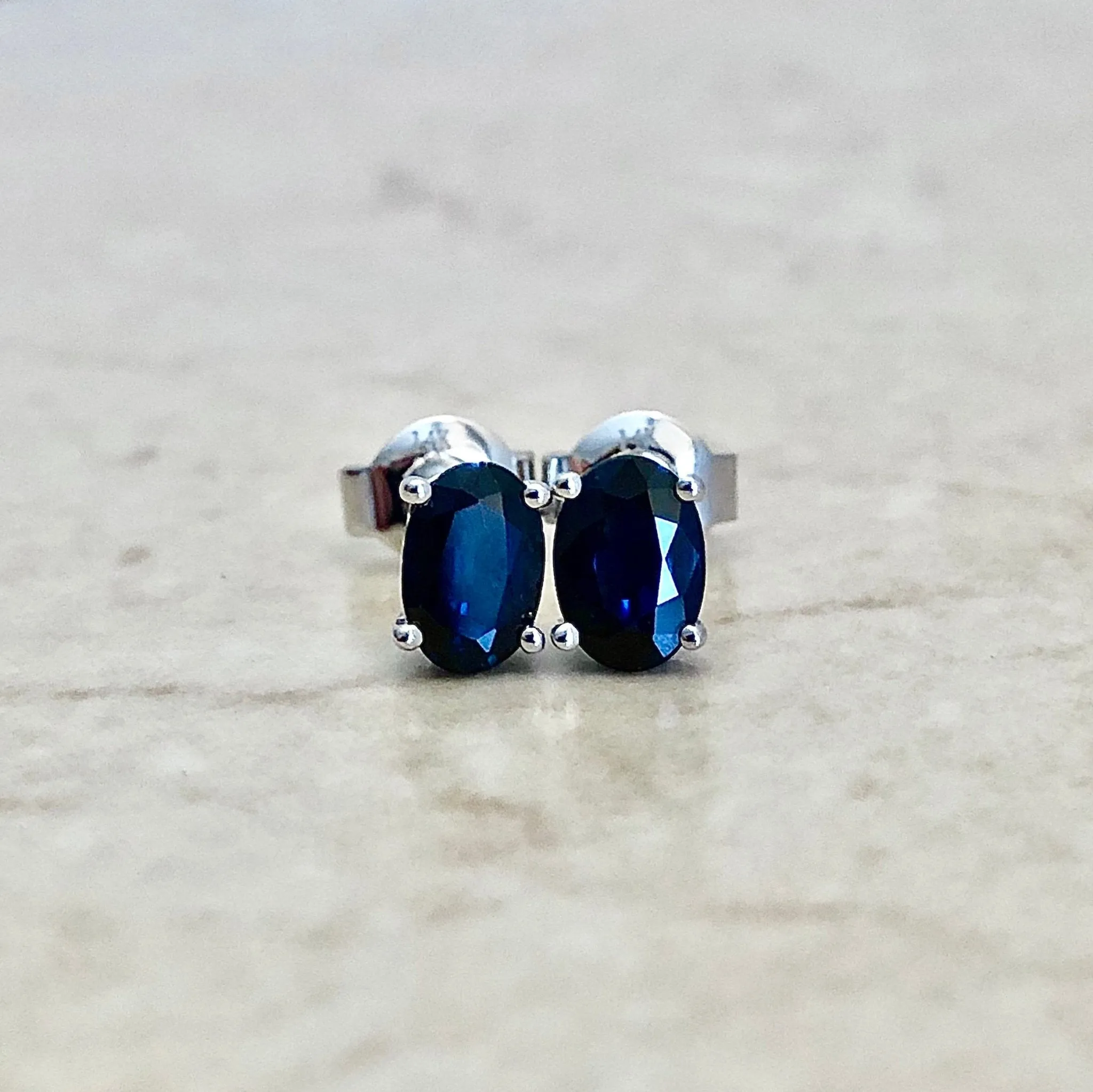 14 Karat White Gold September Birthstone Oval Blue Sapphire Stud Earrings