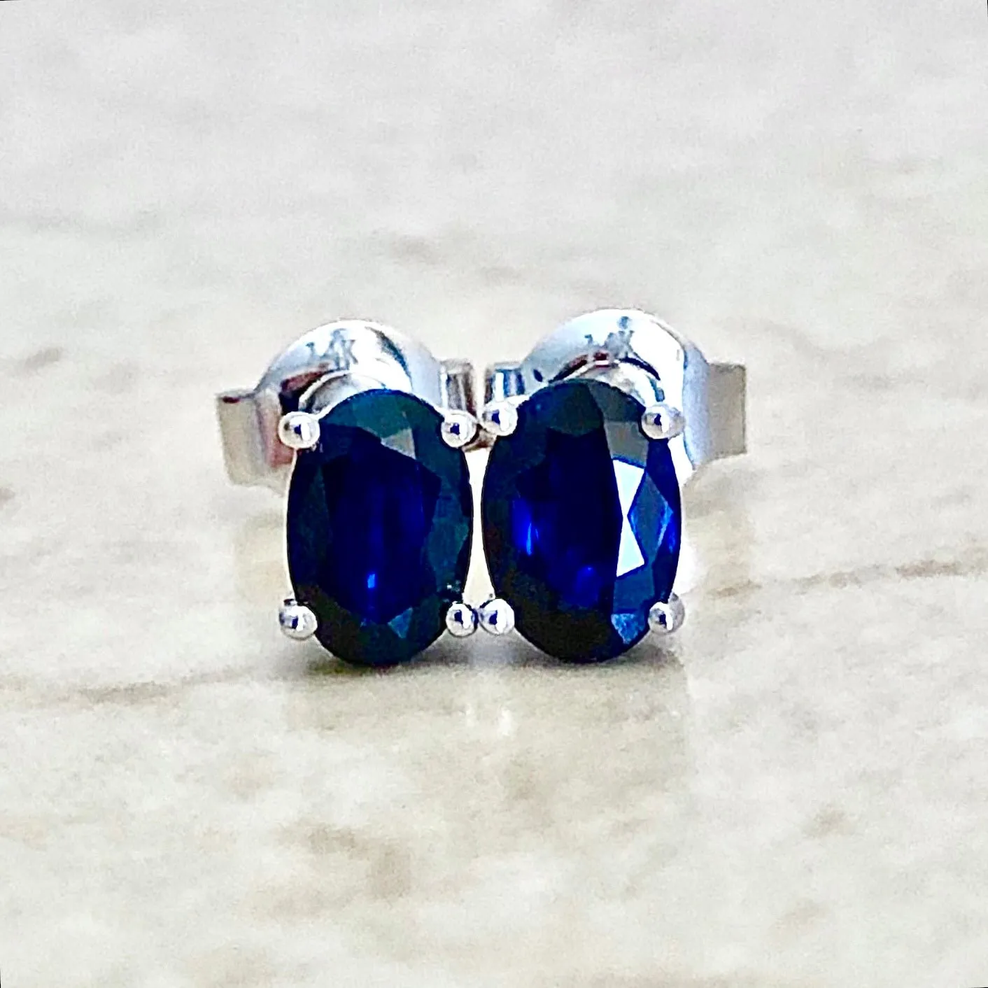 14 Karat White Gold September Birthstone Oval Blue Sapphire Stud Earrings