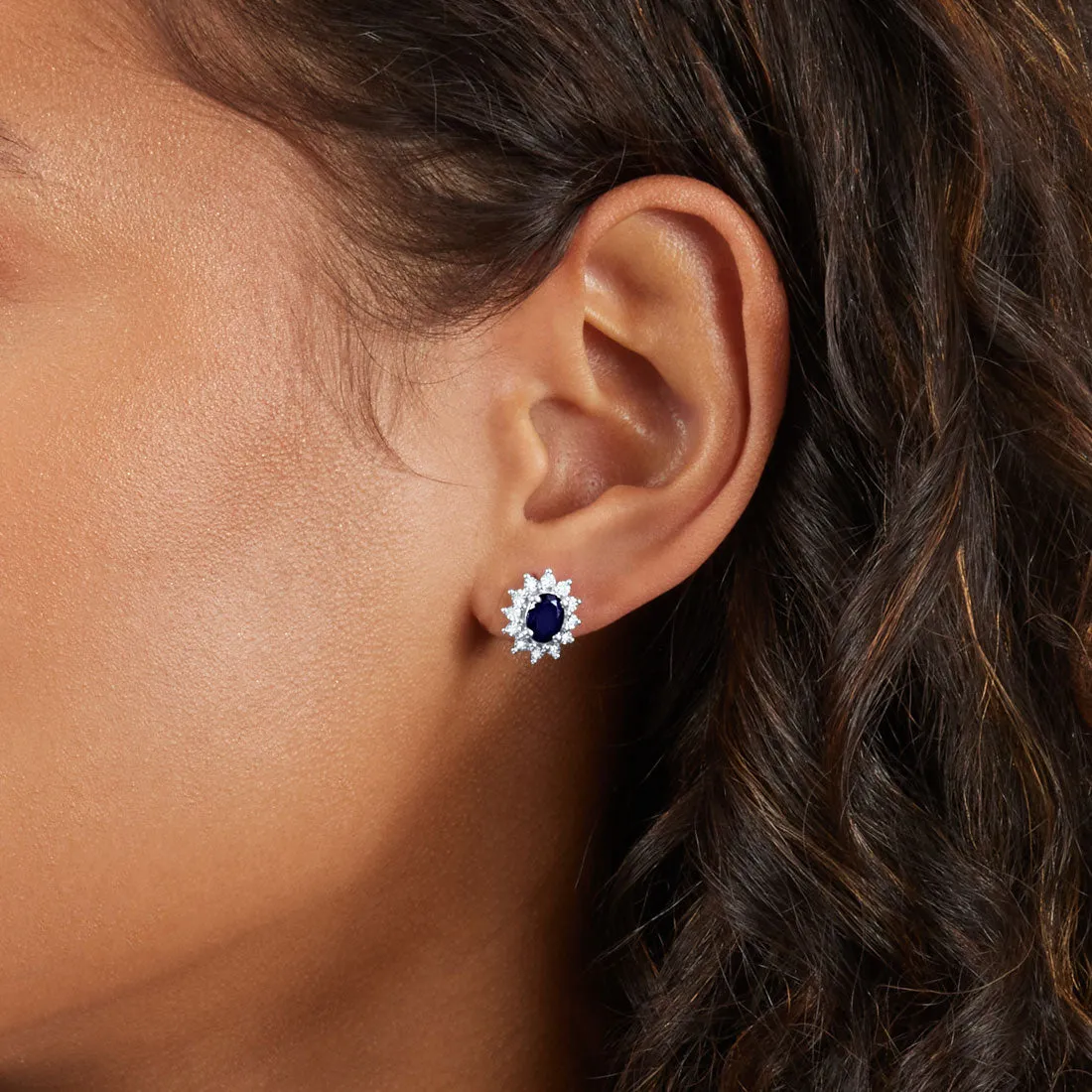 Oval Created Sapphire Stud Earrings with 0.10ct of Diamonds in Sterling Silver