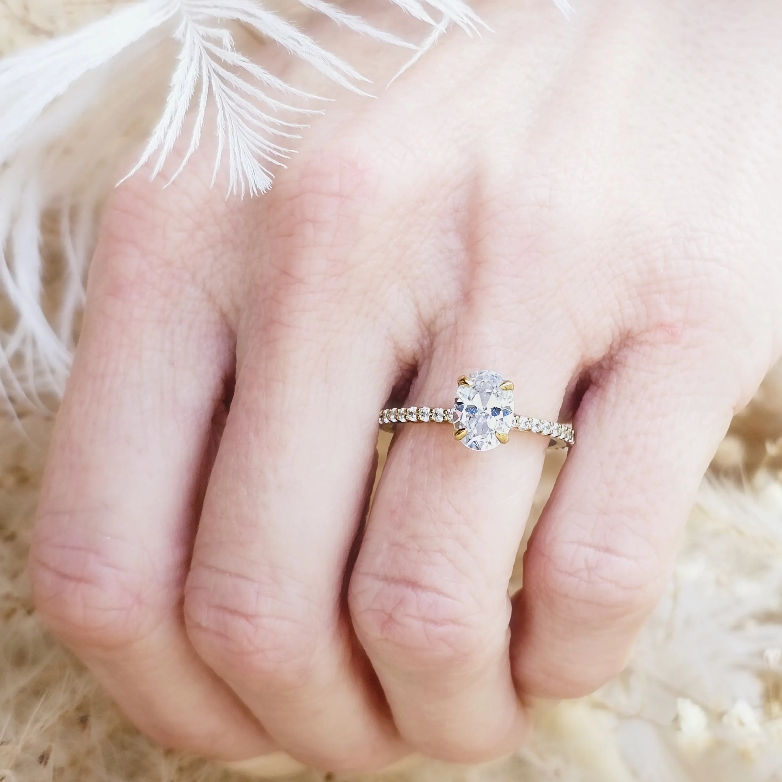 Oval Cut Diamond Solitaire and Pavé Band Engagement Ring