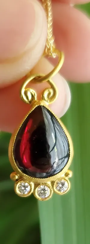 Prehistoric Works 24K Gold pendant with garnet & diamonds