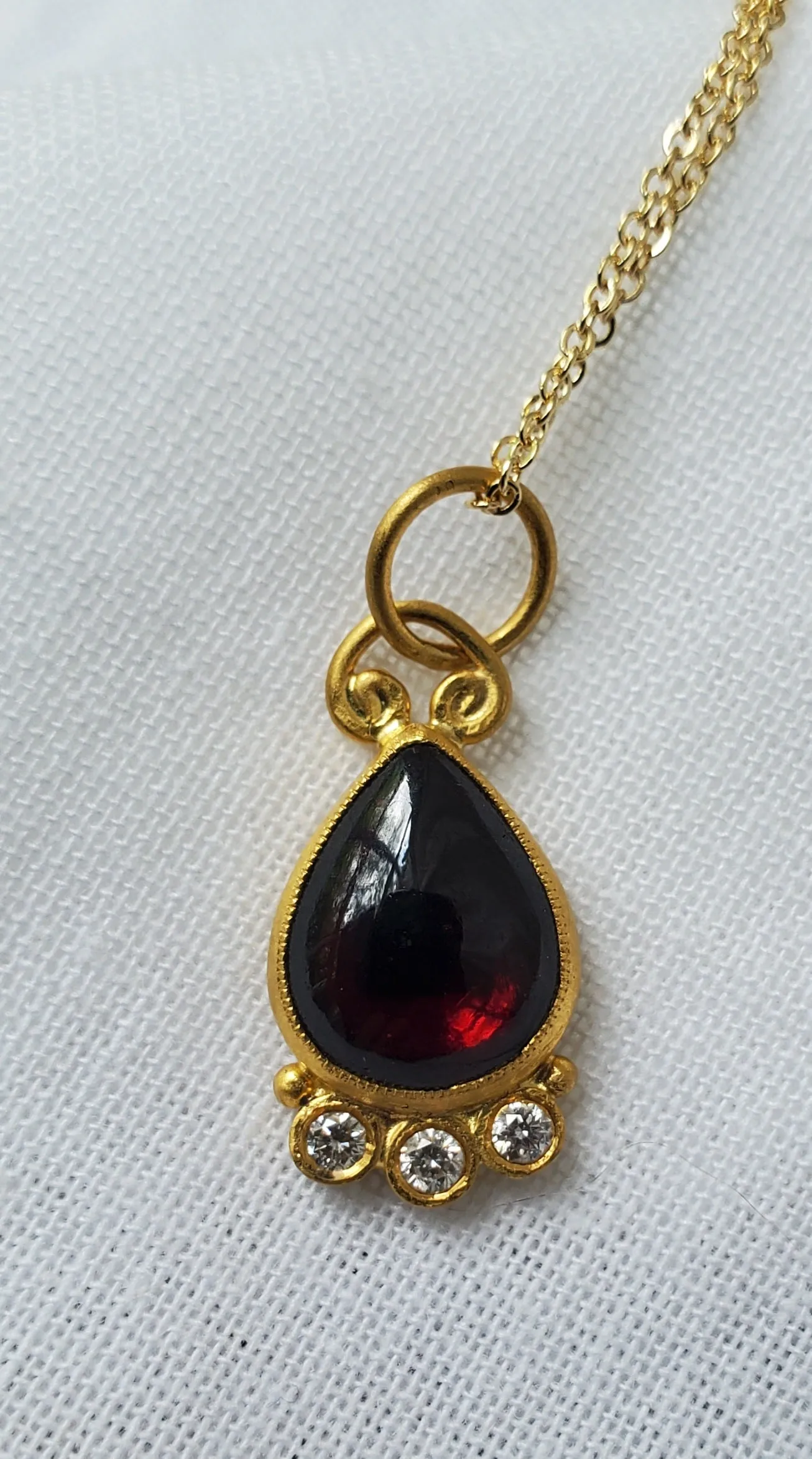 Prehistoric Works 24K Gold pendant with garnet & diamonds