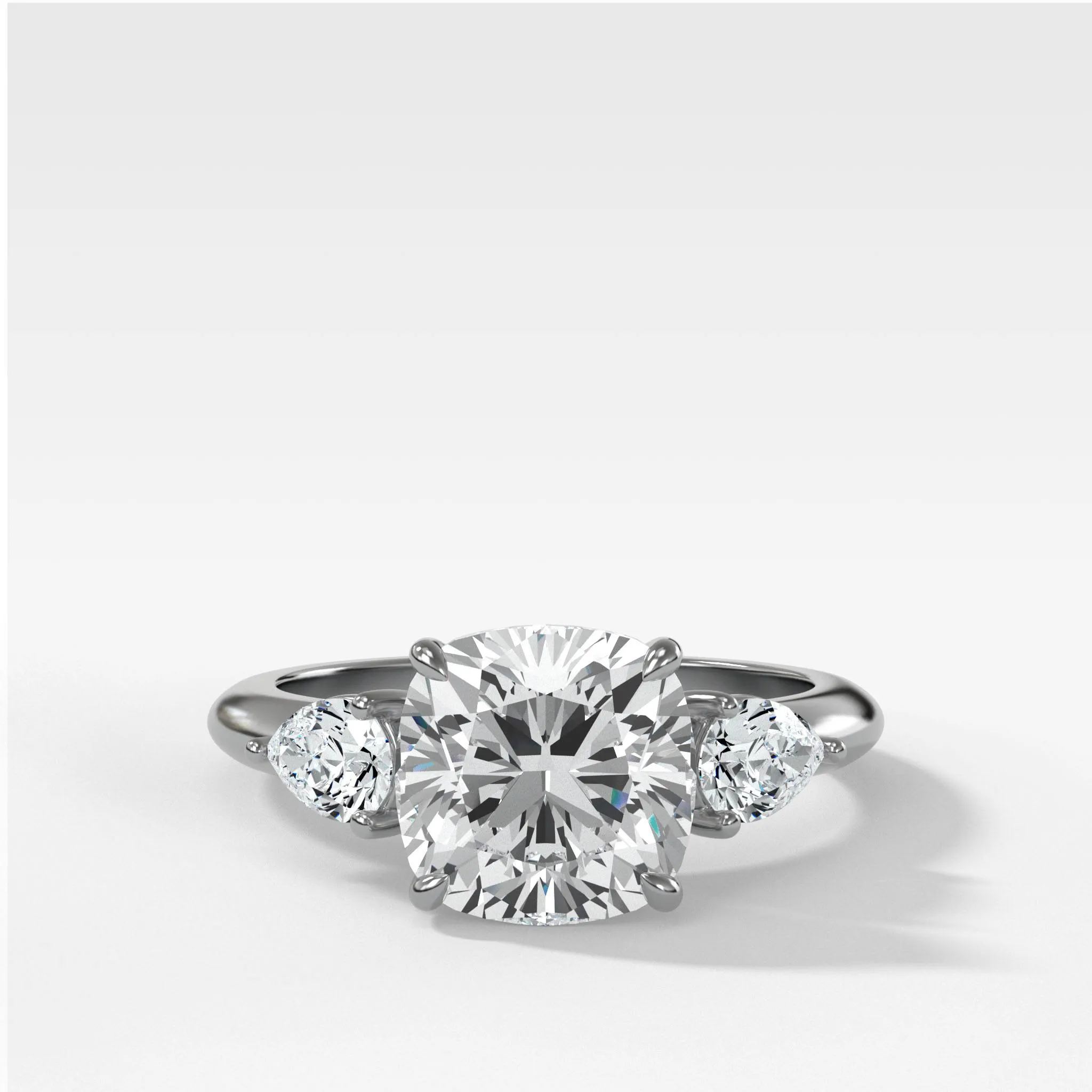 Three Stone Engagement Ring With Pear Side Stones and Cushion Cut Diamond