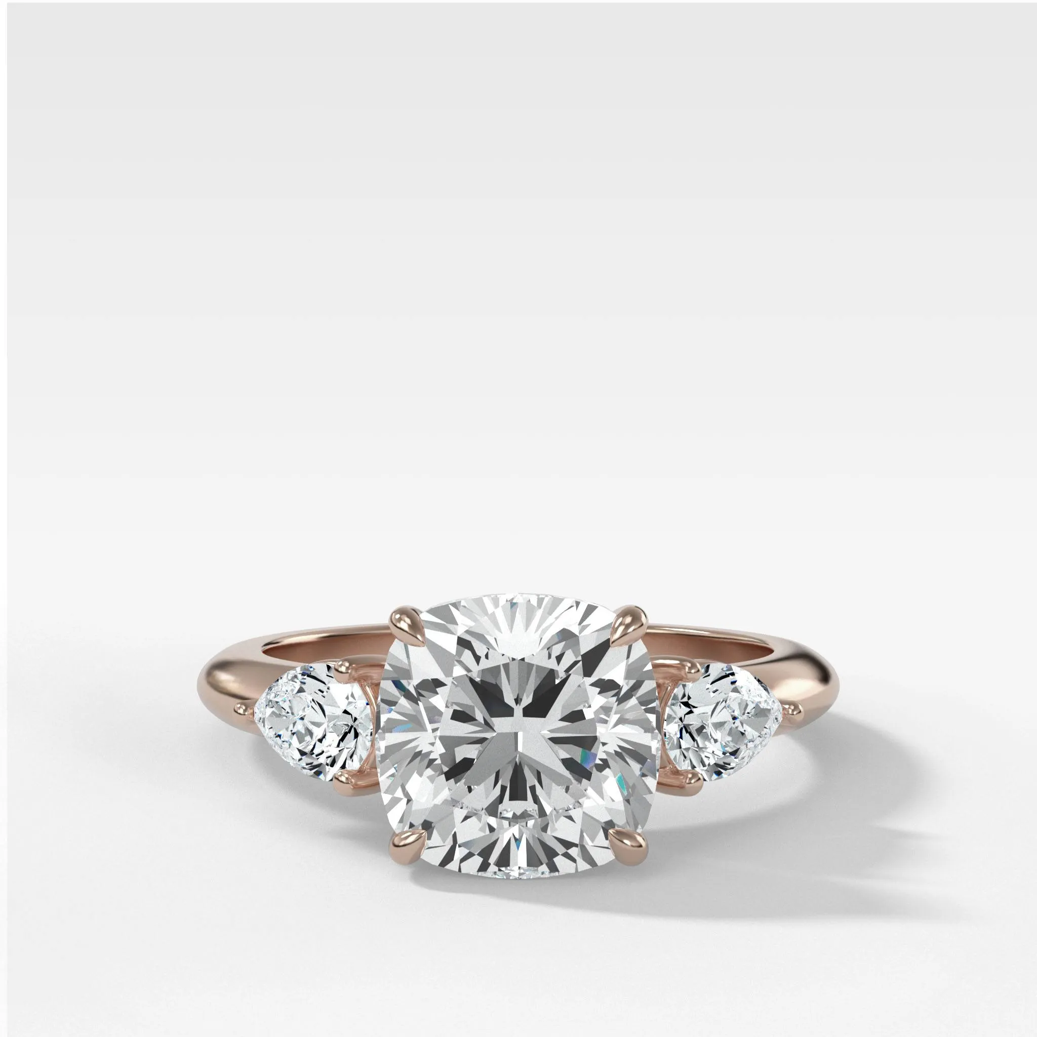 Three Stone Engagement Ring With Pear Side Stones and Cushion Cut Diamond