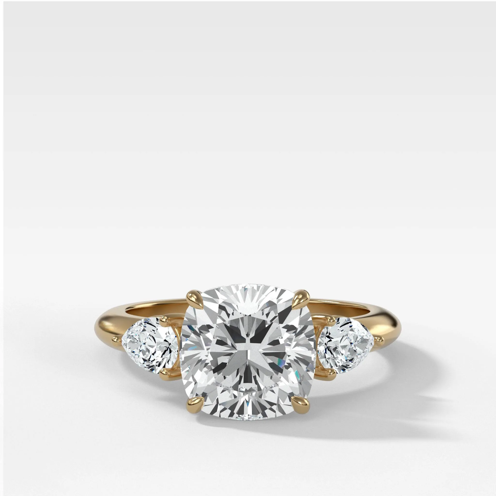 Three Stone Engagement Ring With Pear Side Stones and Cushion Cut Diamond