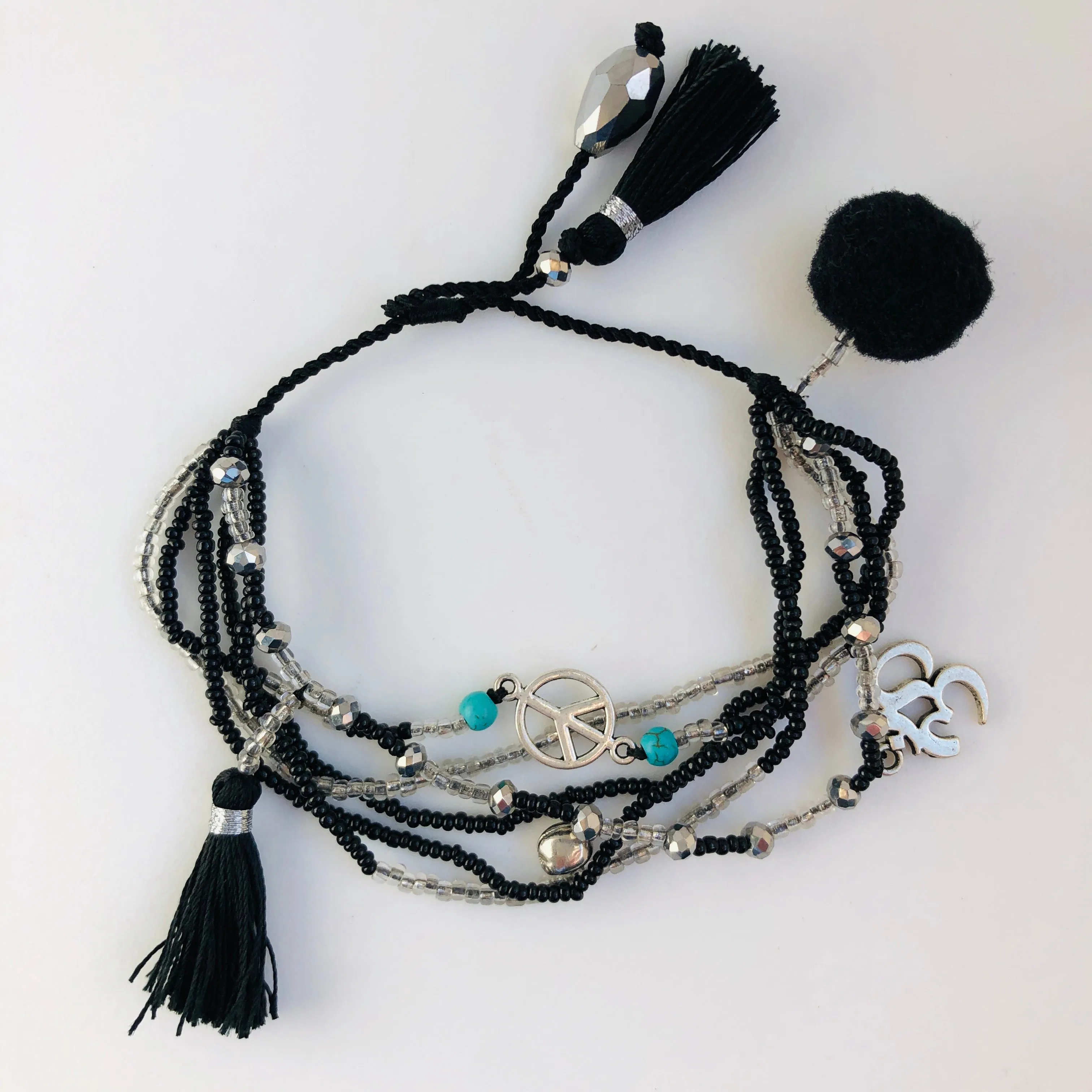 TM. 6 Bead & Charm Bracelet